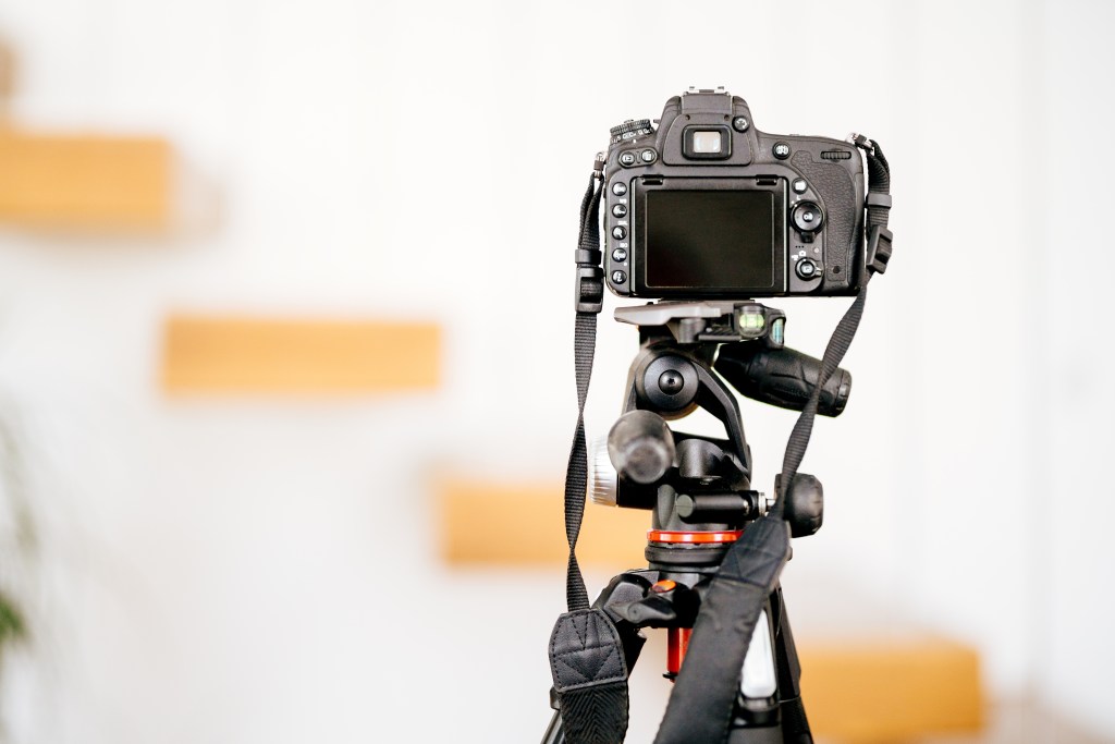 Professional dslr camera standing on tripod