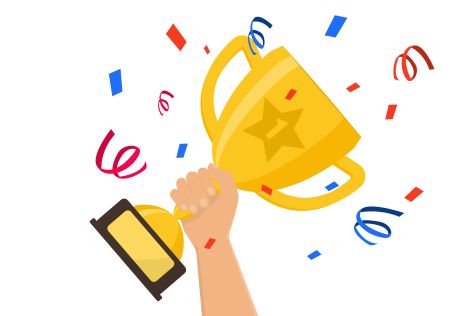 Winner's Cup with a number 1, being held aloft by a hand.